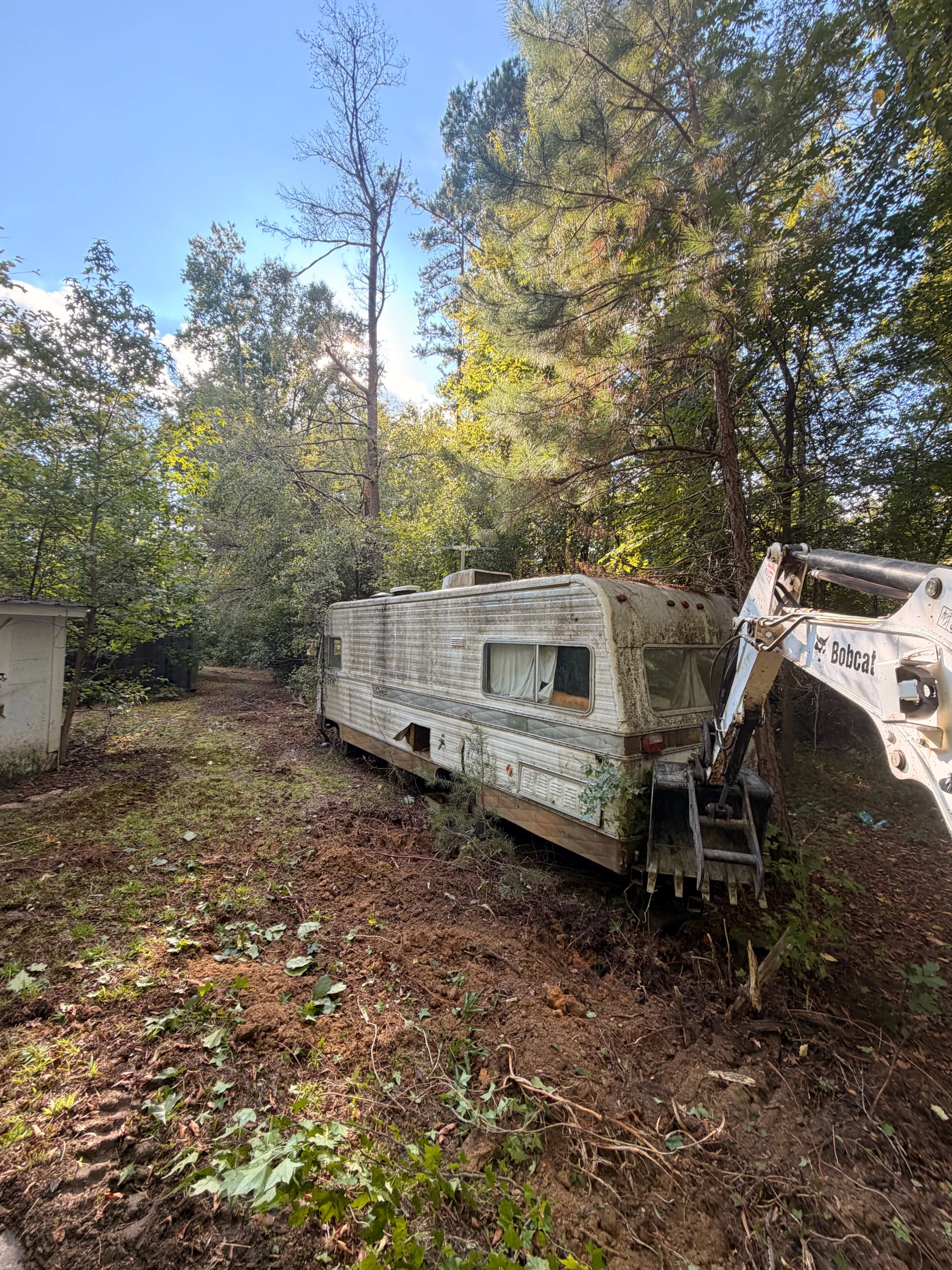Old Camper and Debris Cleared to Get a Property Sale-Ready image